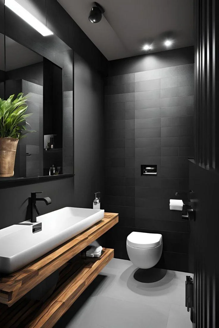 Shower room with a wall-hung vanity and dark tiles